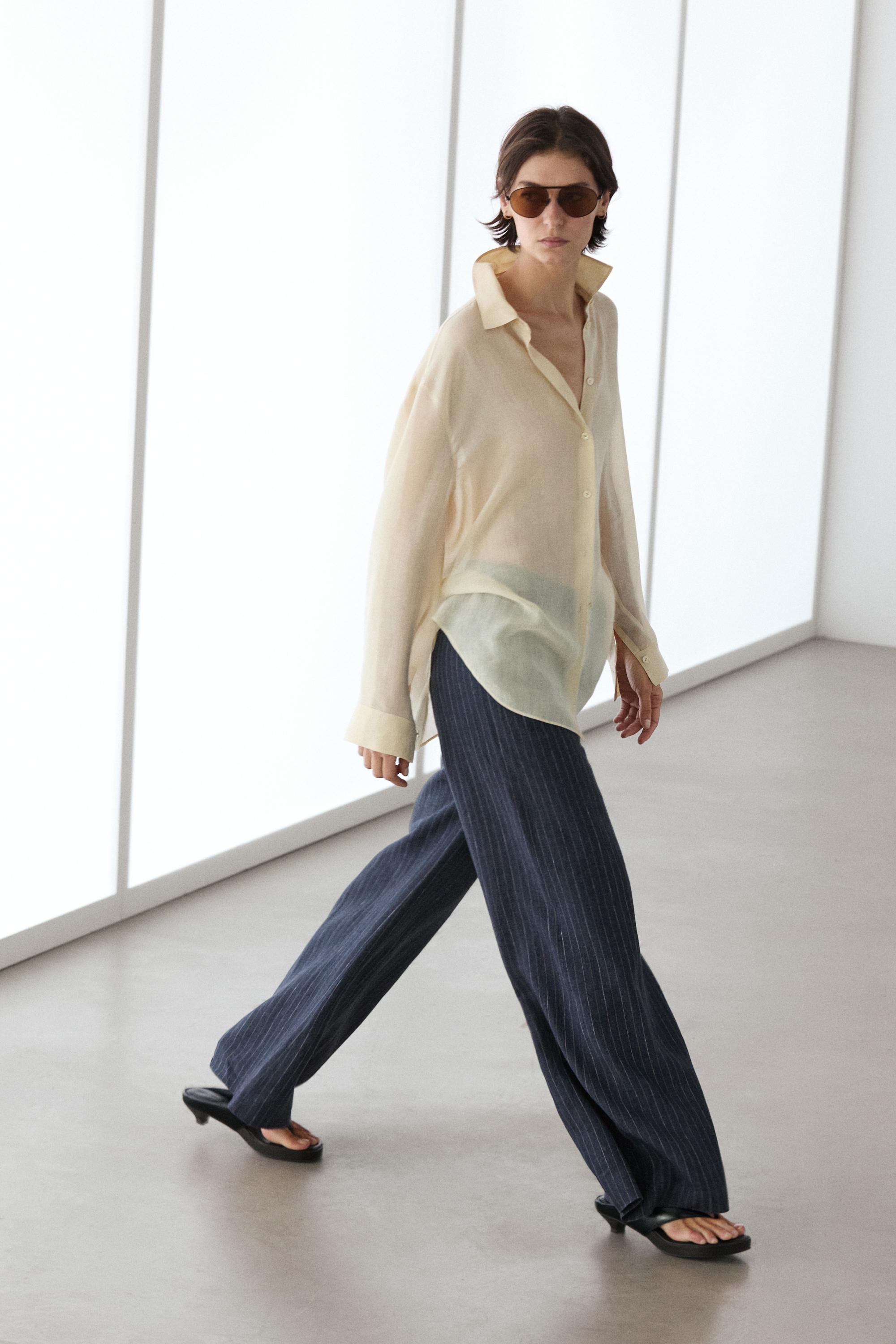 Flare fit linen trousers with striped details